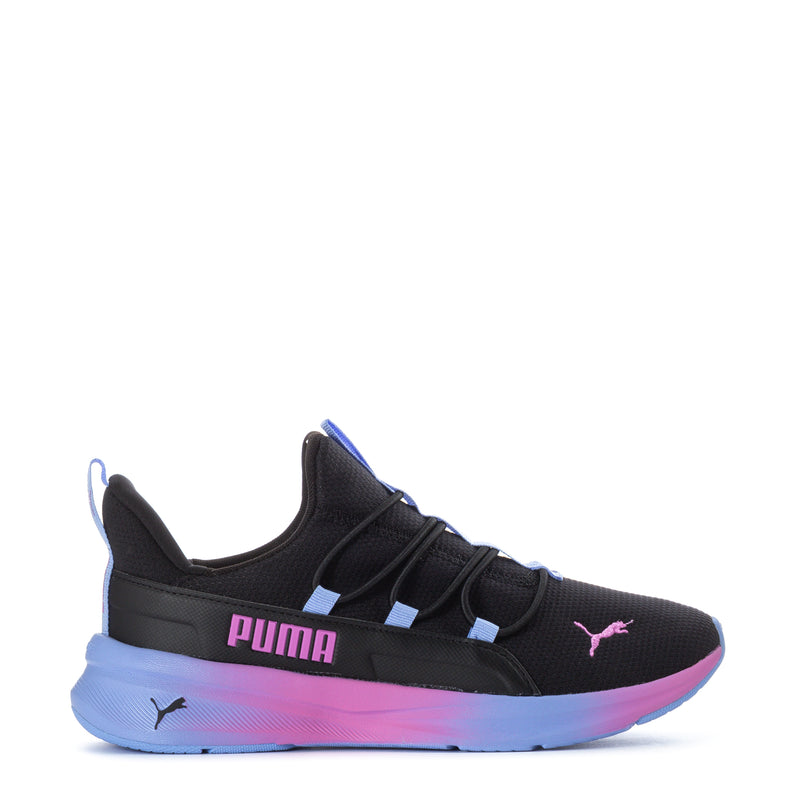 Black youth sneaker with Puma logo, blue-to-pink gradient sole, lace-up design