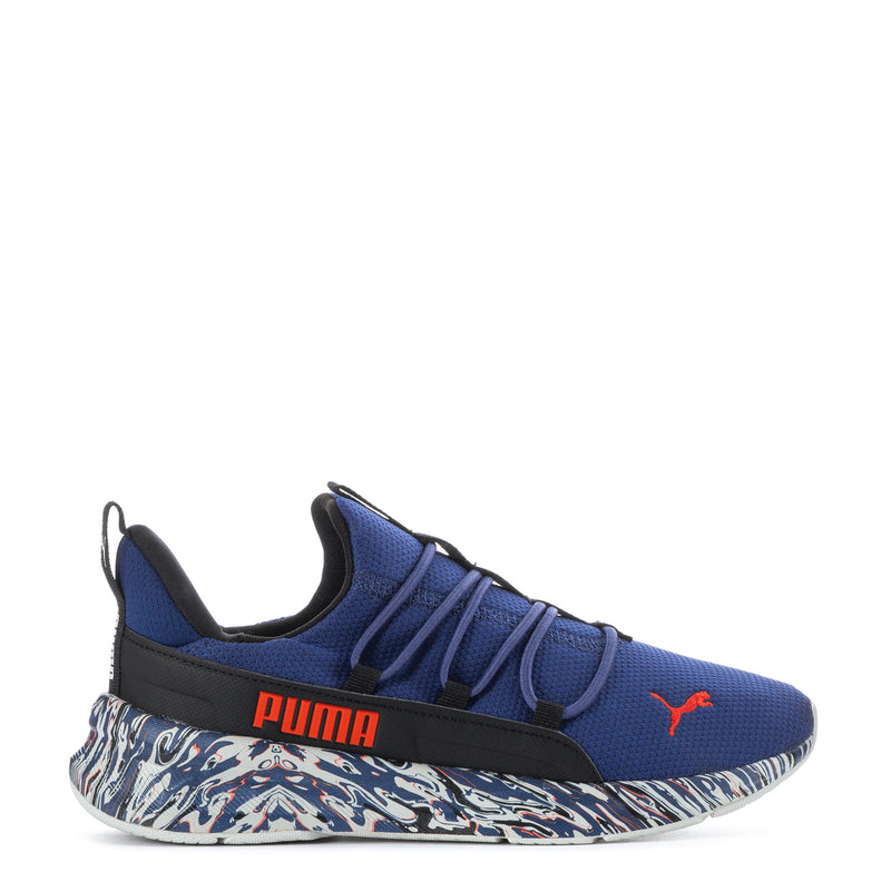 Blue youth knit sneaker with black strap, zebra-pattern midsole, red Puma logo