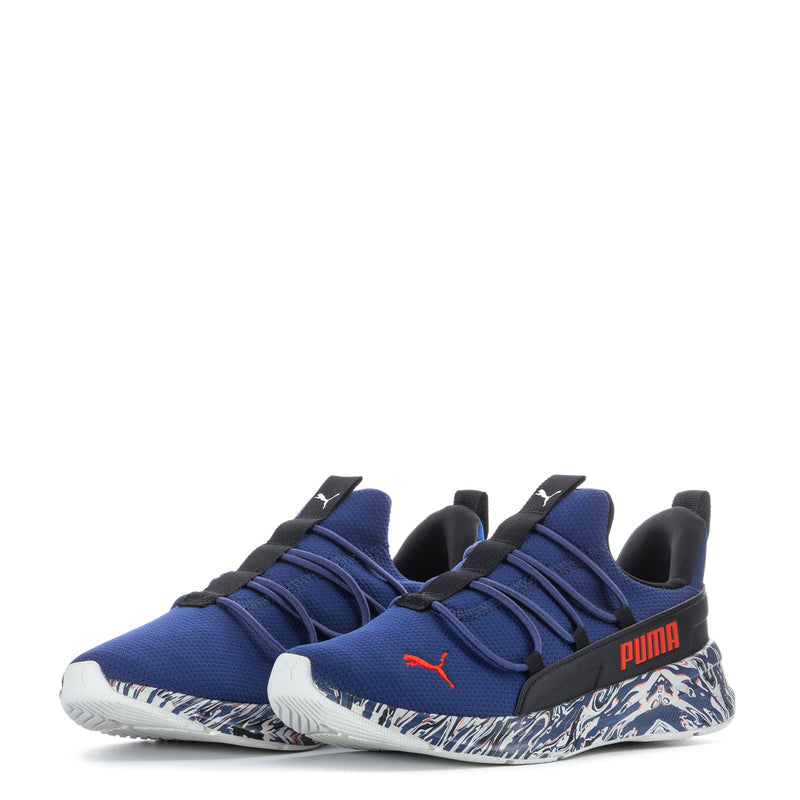 Blue youth knit sneakers with double black straps, patterned midsole, red Puma logo