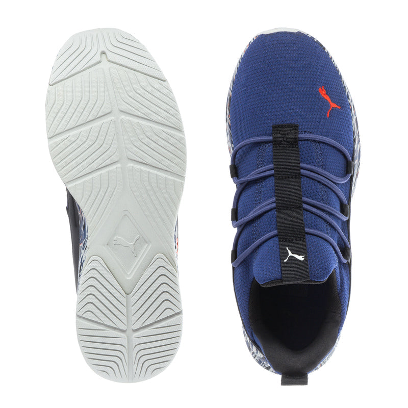 Blue youth sneaker with textured outsole and red Puma logo on the side
