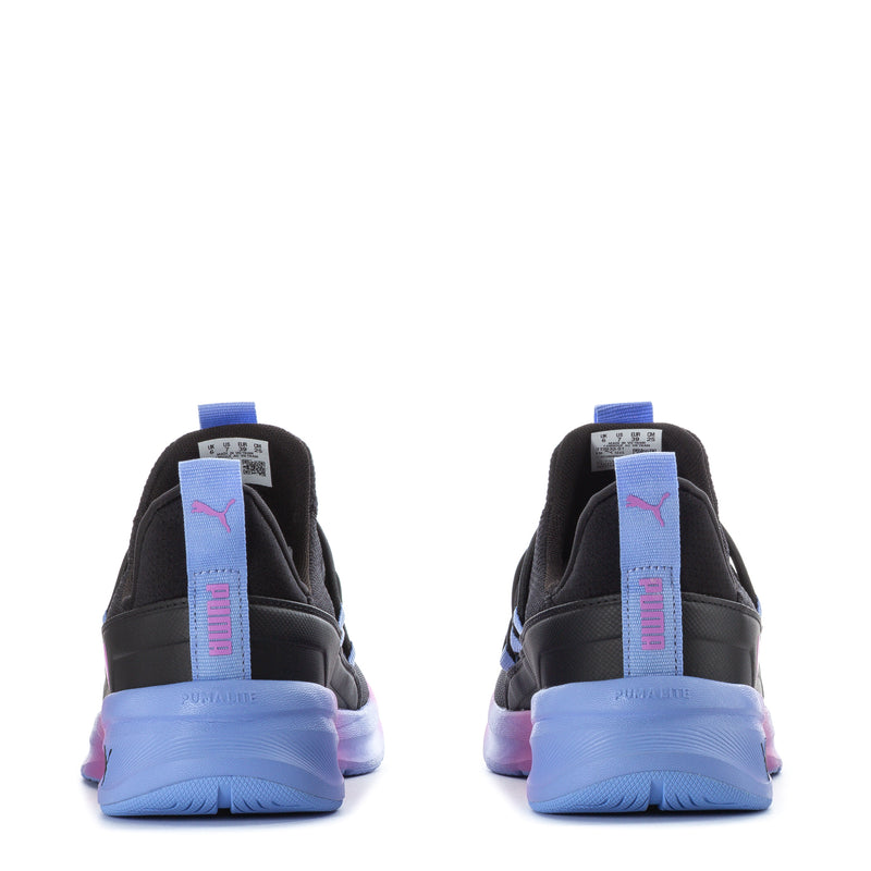 Back view of black youth sneakers with Puma on heel and blue-pink gradient sole