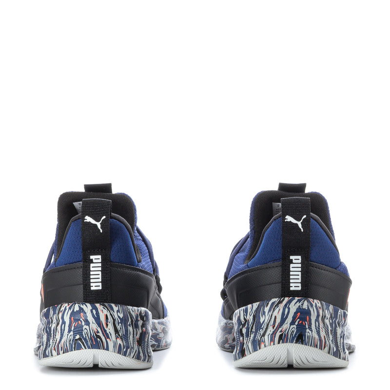 Blue youth sneakers with black heel pull tab, zebra-pattern midsole, red Puma logo