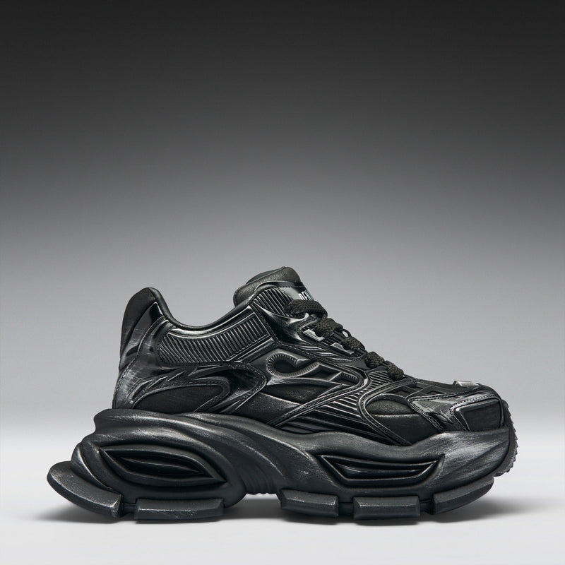 Black sneaker on a gradient gray background