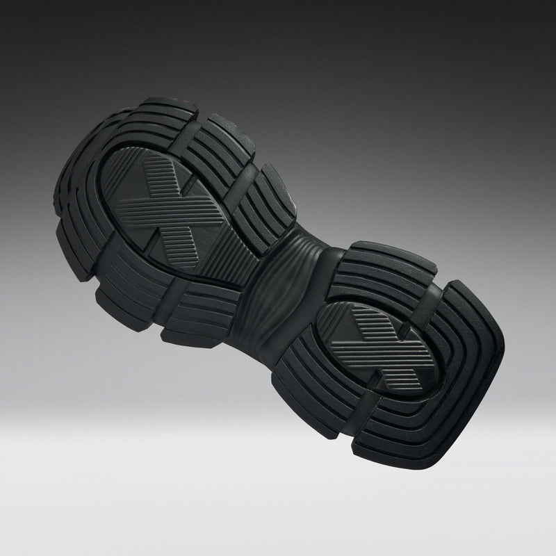 Black rubber mat with textured pattern on a gradient background