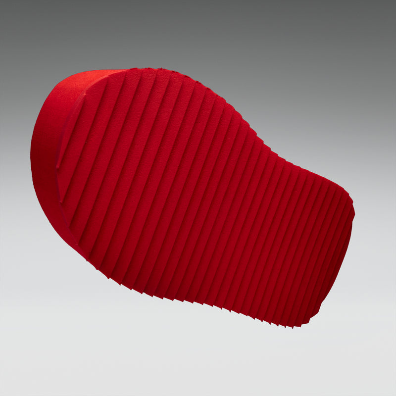 Red shoe sole on a gray background