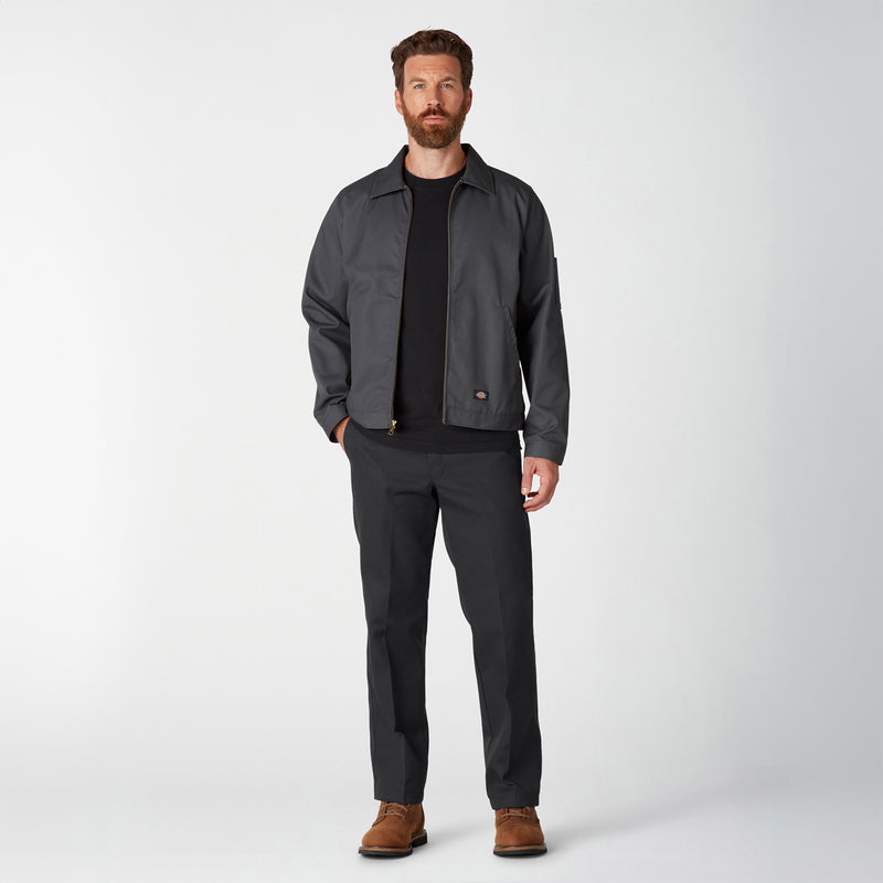 Men's black work pants worn with boots, straight leg