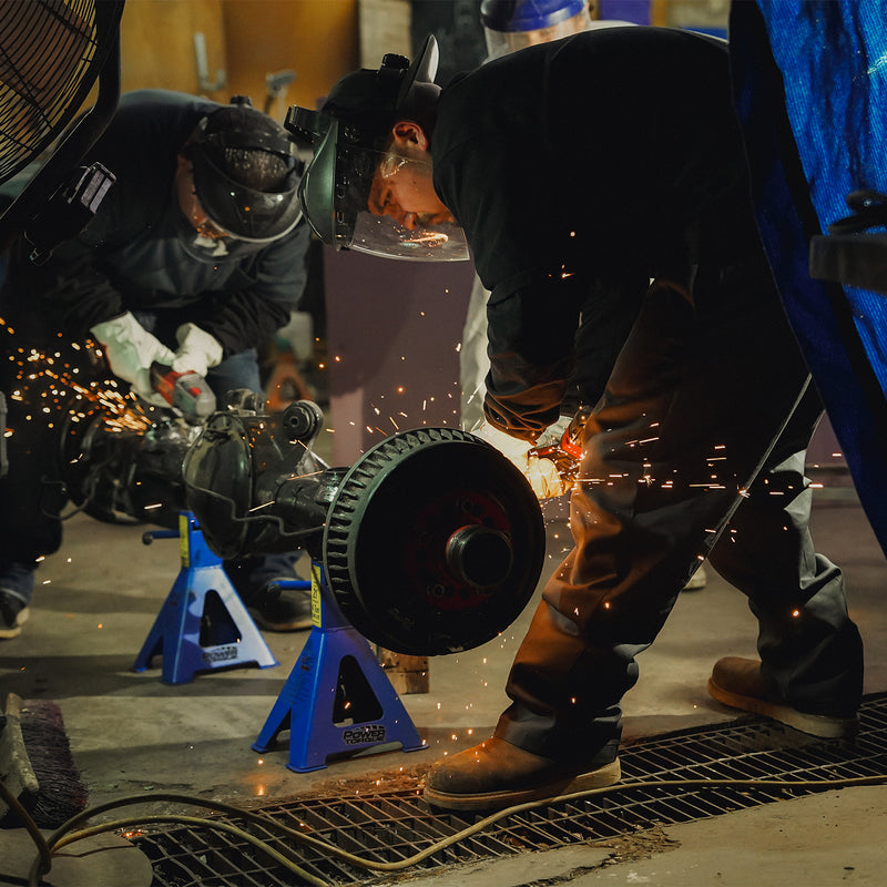 Men's black work pants on a worker, straight leg