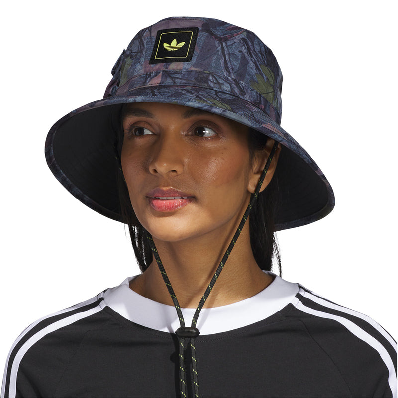 Tree camo bucket hat with wide brim and neon-trim logo patch