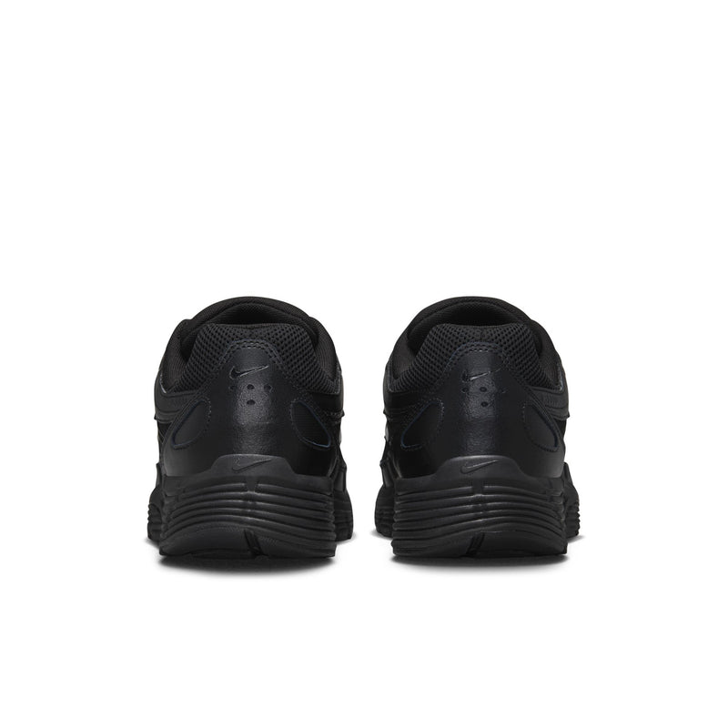 Men's black Nike shoes with padded heel collar and ribbed outsole, rear view