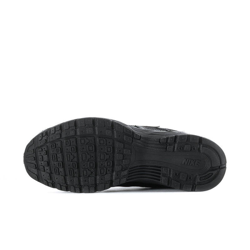 Men's black Nike shoes with rubber outsole showing molded traction pattern