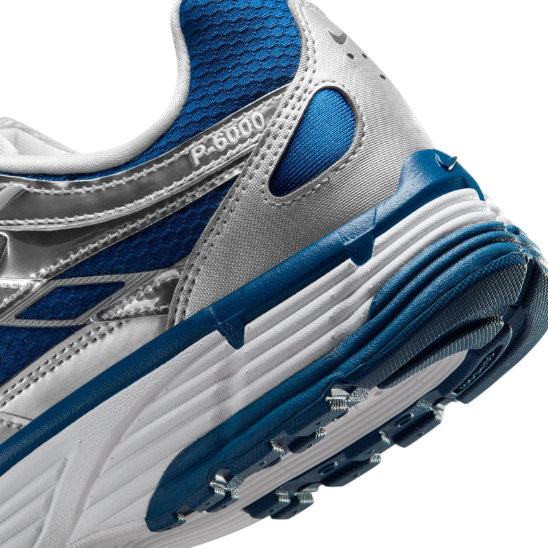 Men's sneaker side close-up with P-6000 label, blue trim, and cushioned sole