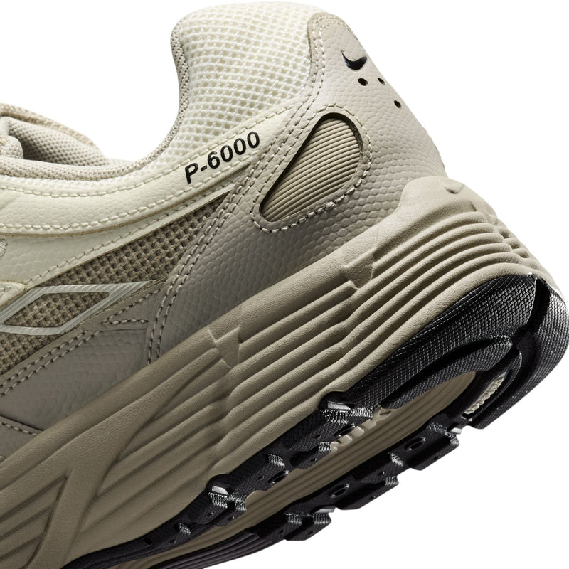 Men's Nike P-6000 SE sneaker close-up, P-6000 branding on side and ribbed midsole