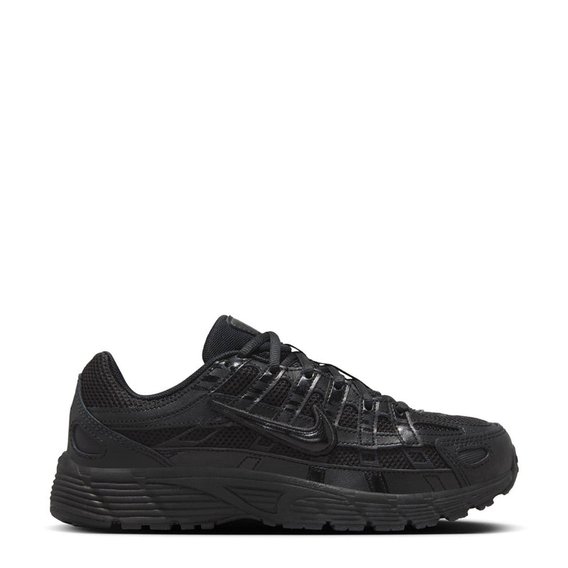 Black lace-up sneakers with mesh upper, chunky sole, and Nike side logo