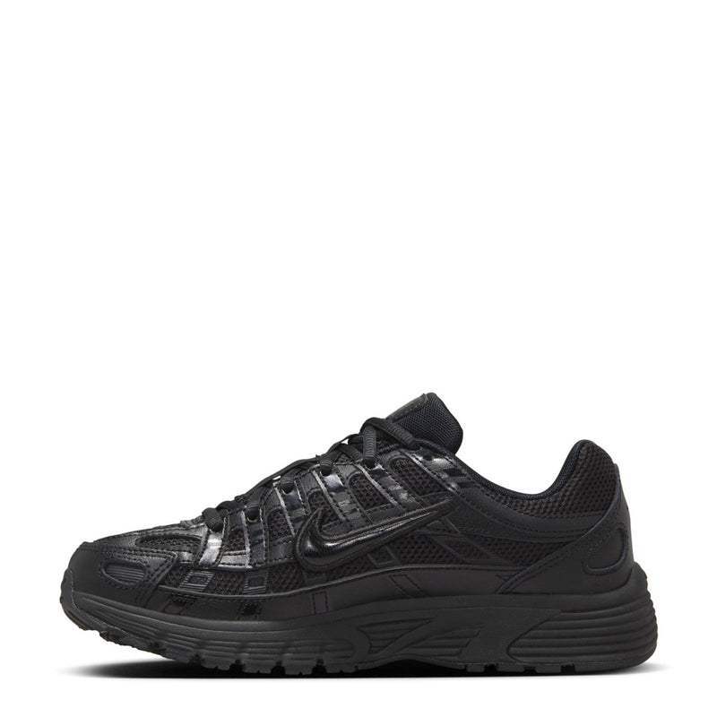 Black lace-up sneakers, side profile with Nike swoosh and patterned mesh