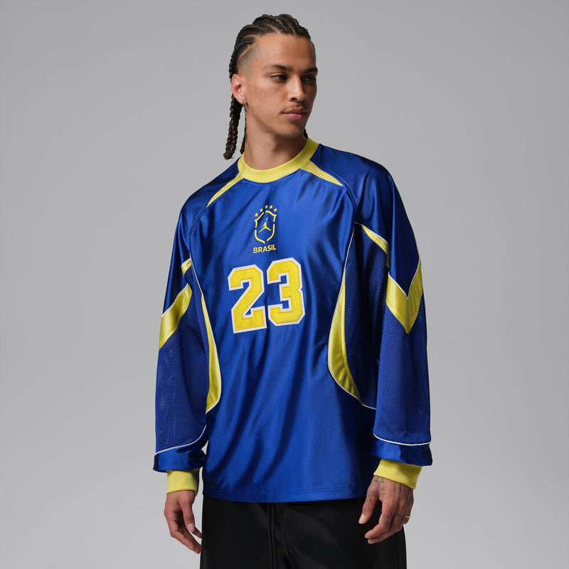 Men's royal blue goalie jersey with yellow piping and number 23 on the chest.