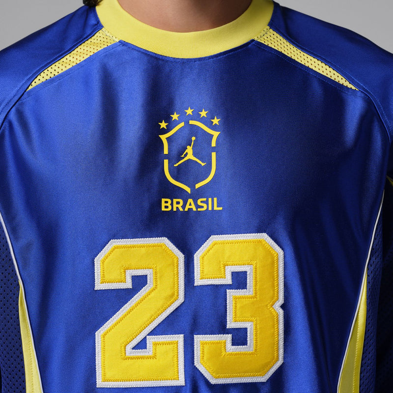 Royal blue goalie jersey front with BRASIL crest and large number 23 in yellow.