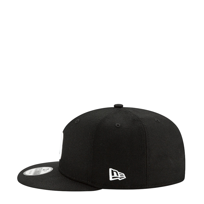 Black baseball cap with small white NE flag logo on front