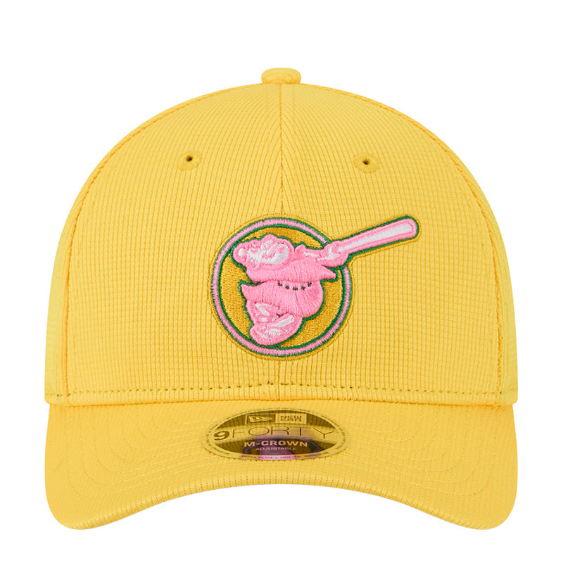 Yellow baseball cap with pink embroidered logo and M-Crown patch