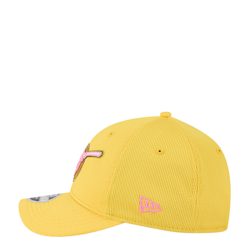 Yellow baseball cap with pink side embroidery and curved brim