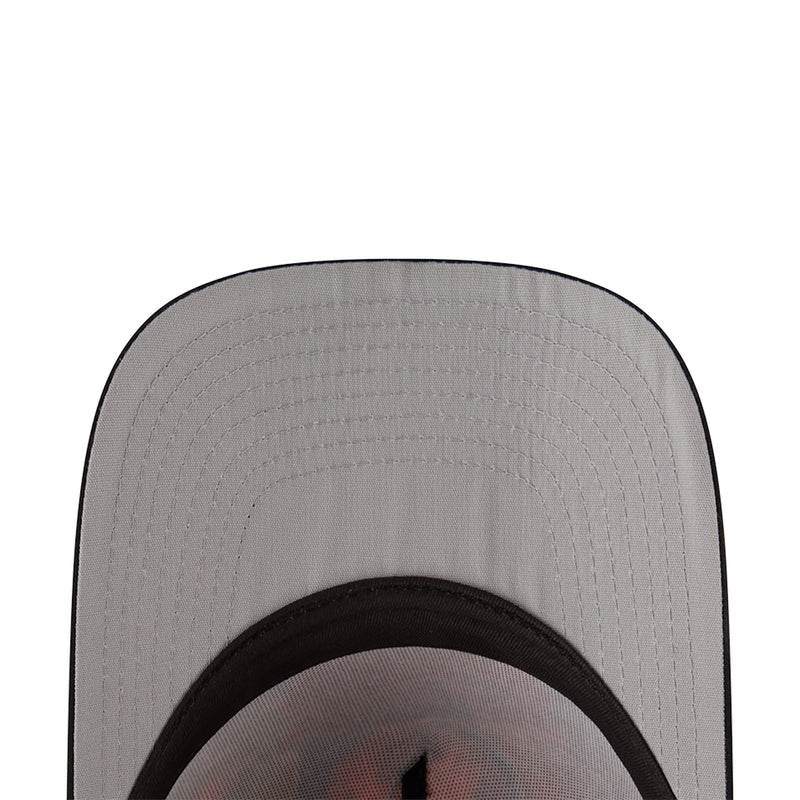 Two-tone cap close-up of light gray interior panel with textured stitching