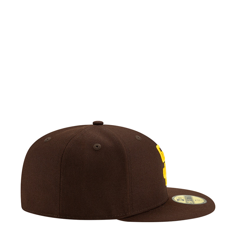 Brown baseball cap side view with yellow logo patch