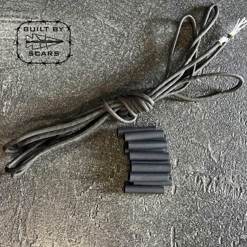 GORUCK paracord and heat shrink tubing kit on textured gray surface, Built by Scars logo