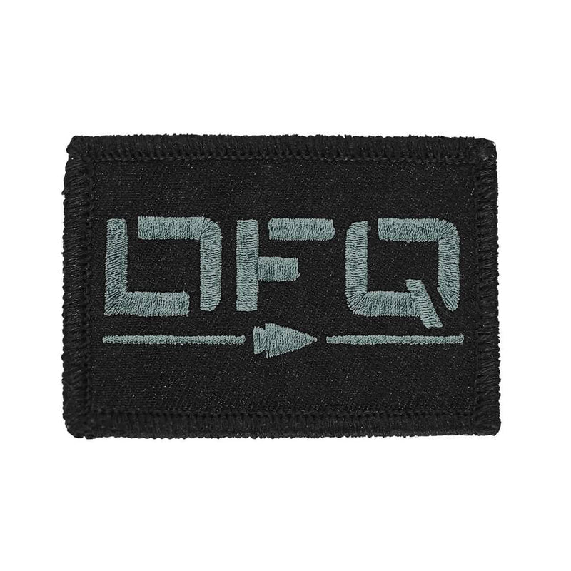 GORUCK black embroidered patch with stylized grey lettering and arrow design