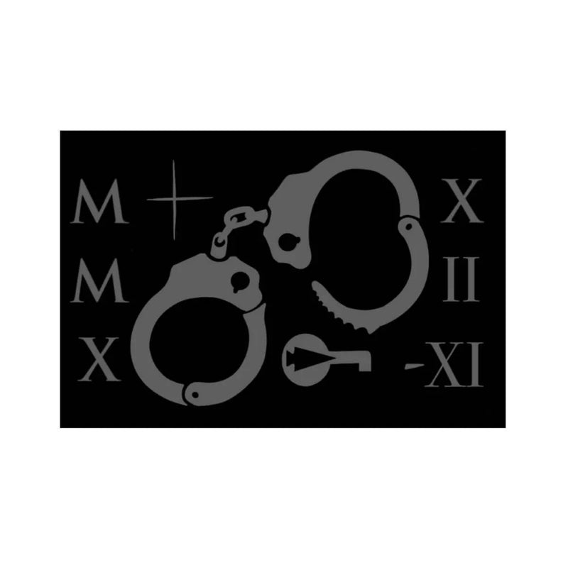 GORUCK Tribe patch with grey handcuffs, key, and Roman numerals on black background
