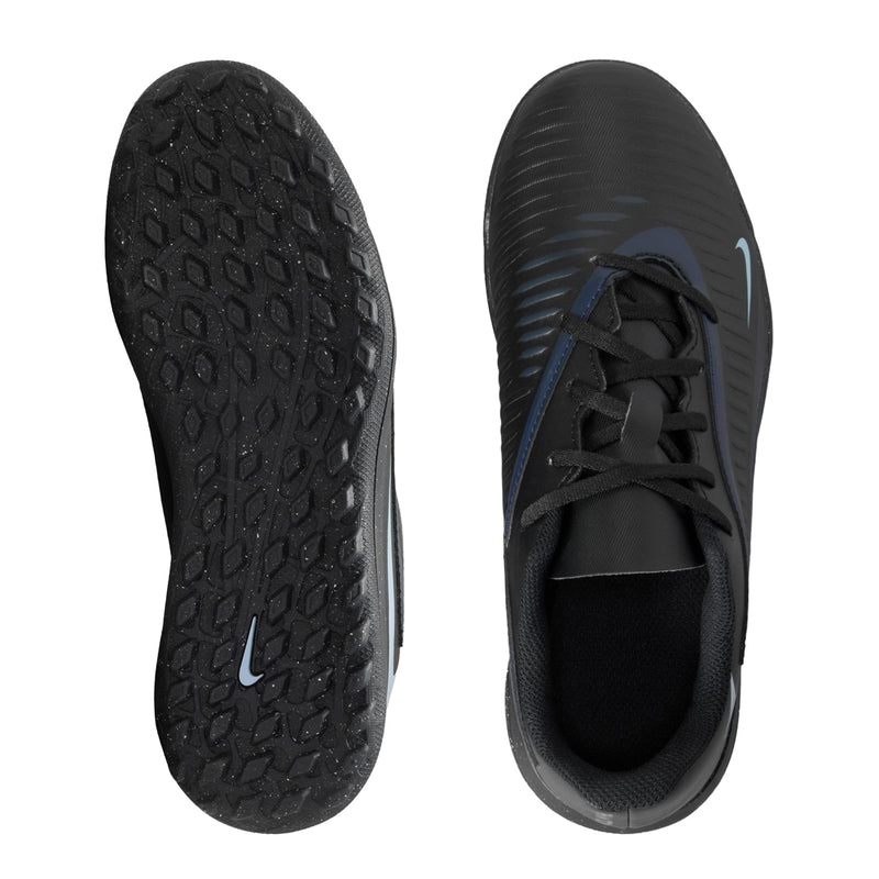 Youth soccer turf shoes shown from outsole and inside, textured black tread with blue accents