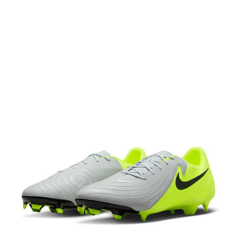 Men's FG soccer cleat angled view with metallic silver upper and volt green heel.