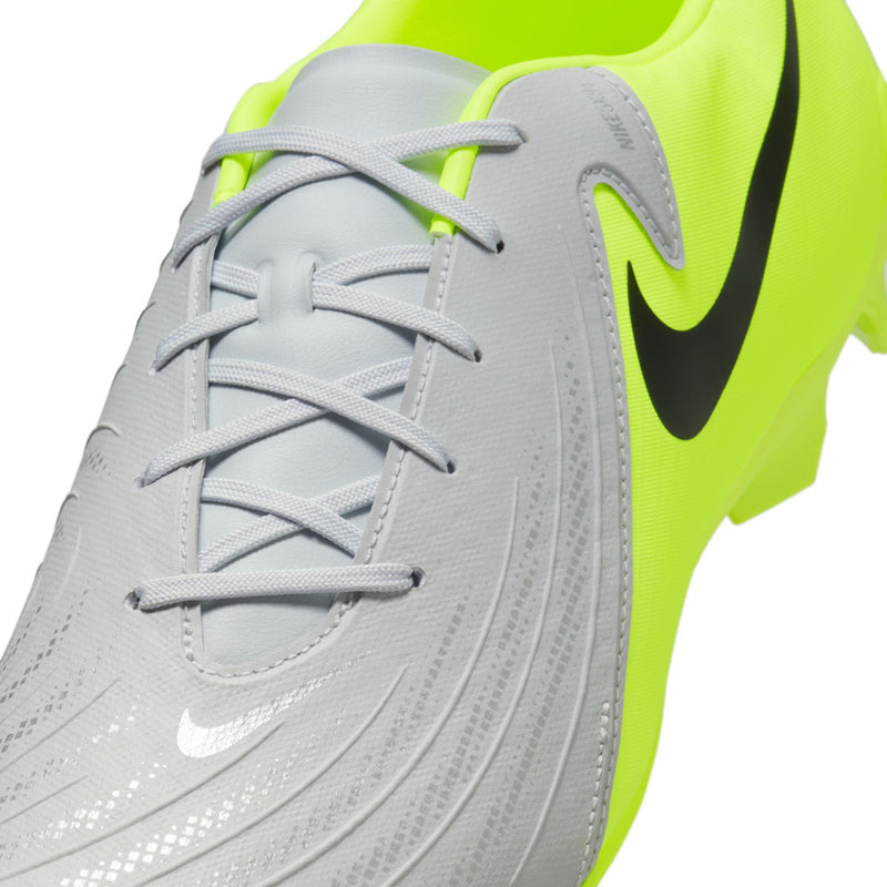 Men's FG soccer cleat close-up of lace-up front with metallic silver texture and volt trim.