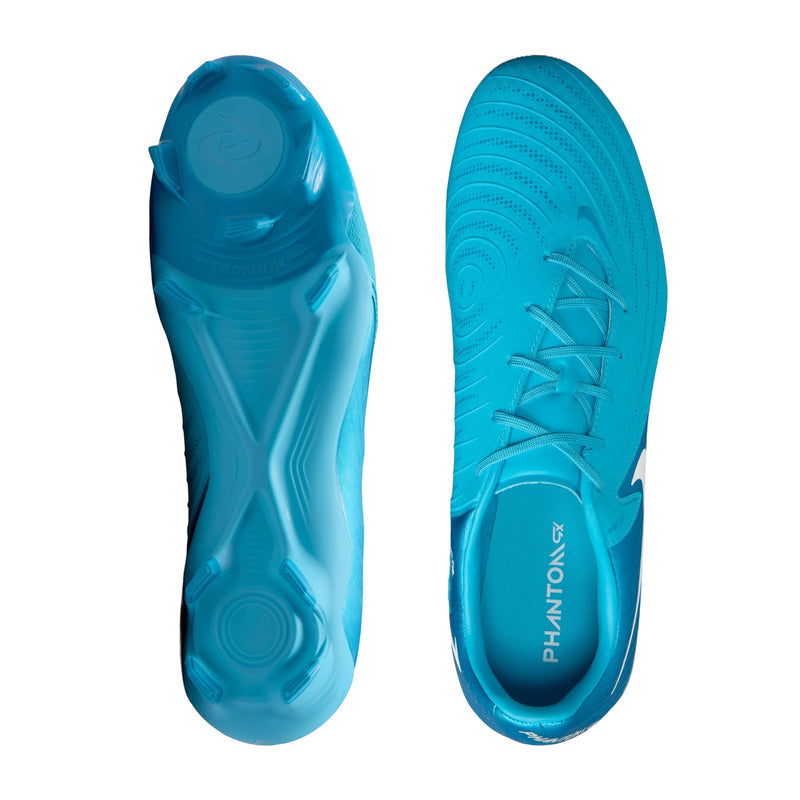 Undersides of turquoise blue soccer cleats with molded traction studs