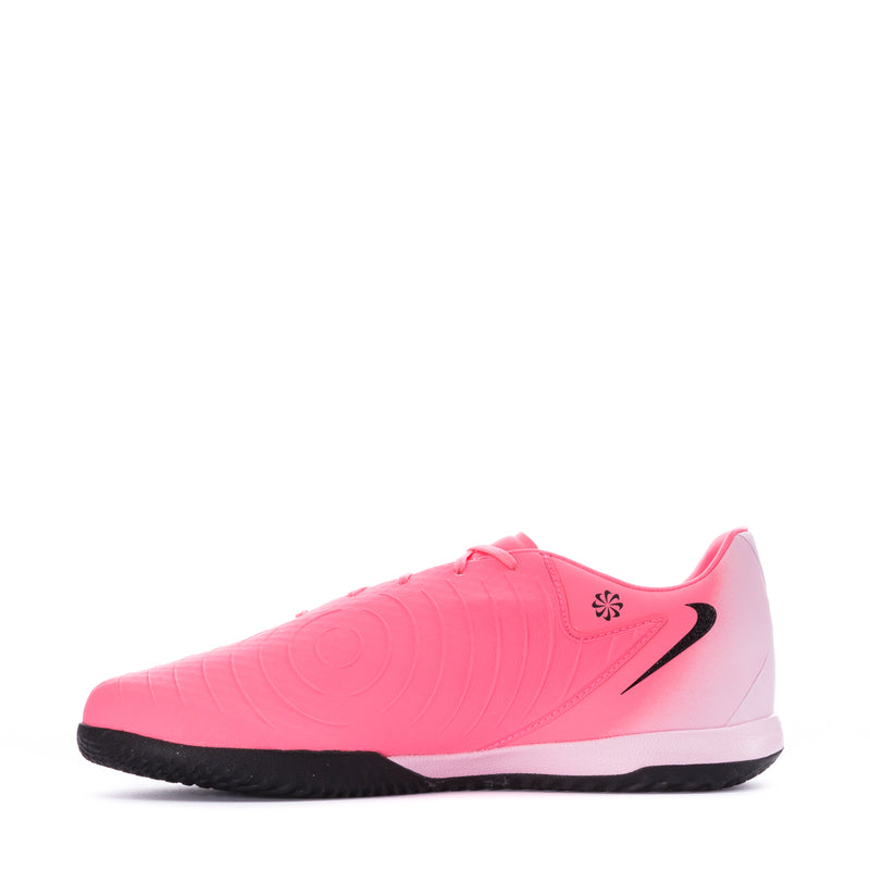 Pink lace-up soccer shoe with black accents and textured sole