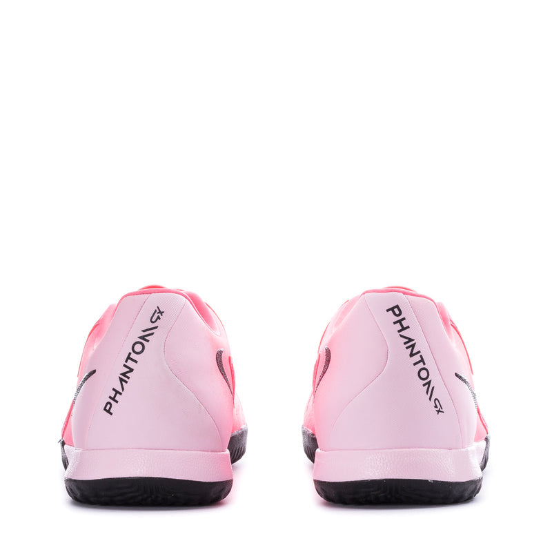 Pink soccer cleats heel view with "PHANTOM" branding and black rubber sole