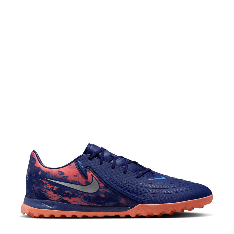 Men's dark blue turf soccer shoes with orange outsole and speckled side panels
