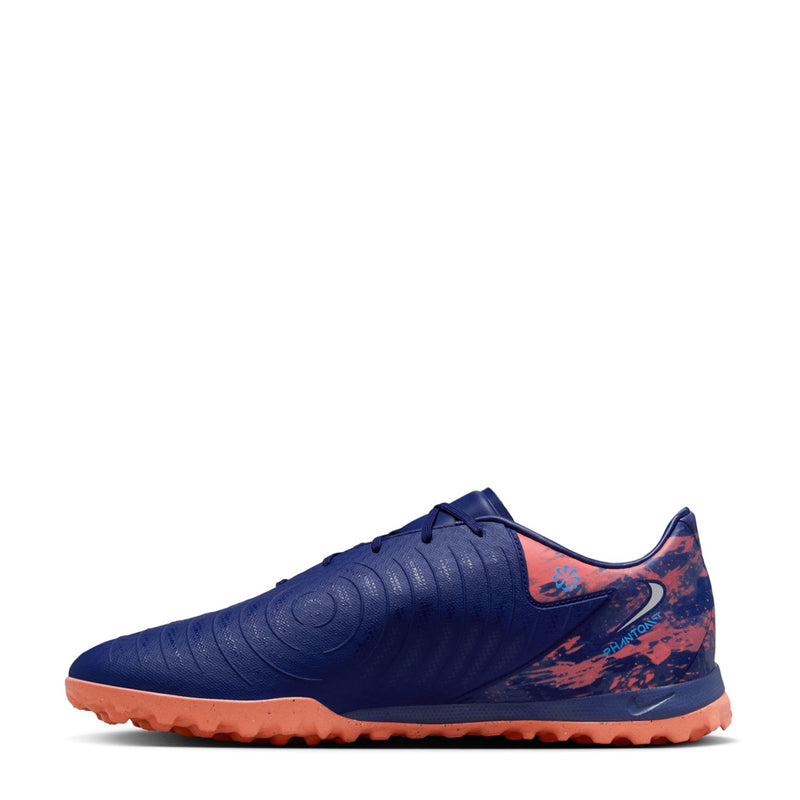 Men's dark blue turf soccer shoes, side view with speckled orange accents