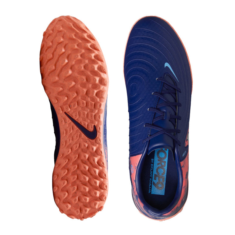 Pair of turf soccer shoes, dark blue uppers with orange textured outsoles