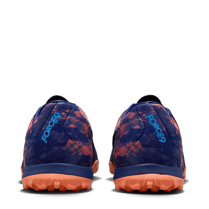 Back view of men's turf soccer shoes in dark blue with orange speckled heel