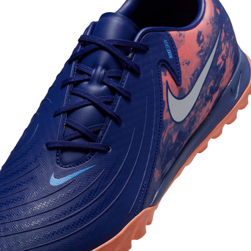 Close-up of men's dark blue turf shoes with navy laces and speckled panels
