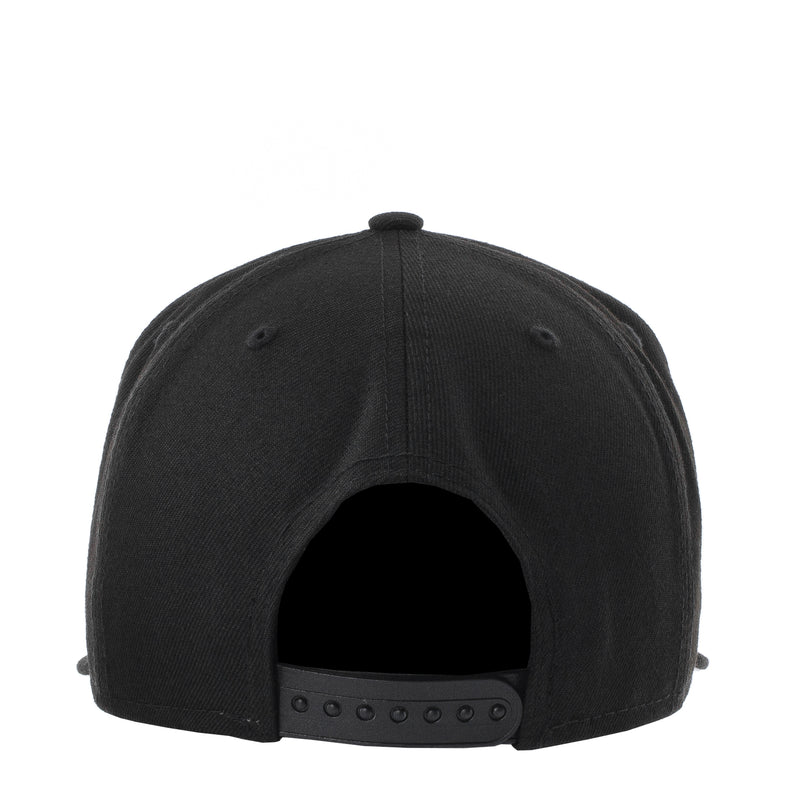 Black baseball cap rear view with buttoned strap and ventilation holes