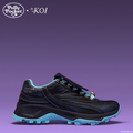 Black and blue sneaker with 'Polly Pocket' and 'Koi' branding on a purple background