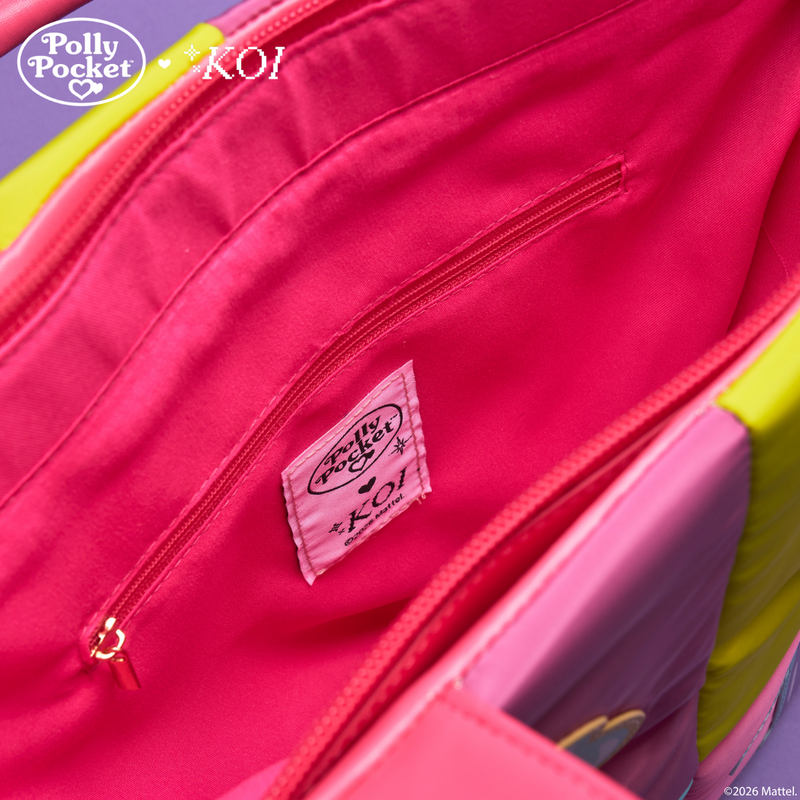 Close-up of a pink bag with a label featuring 'Polly Pocket' and 'KOI' branding.
