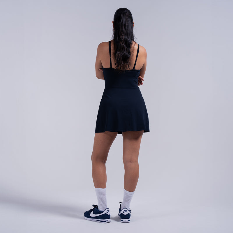 Black A-line skater dress back view with spaghetti straps