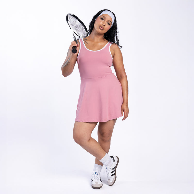 Rose pink sleeveless mini dress with white-trim scoop neckline, fit-and-flare skirt