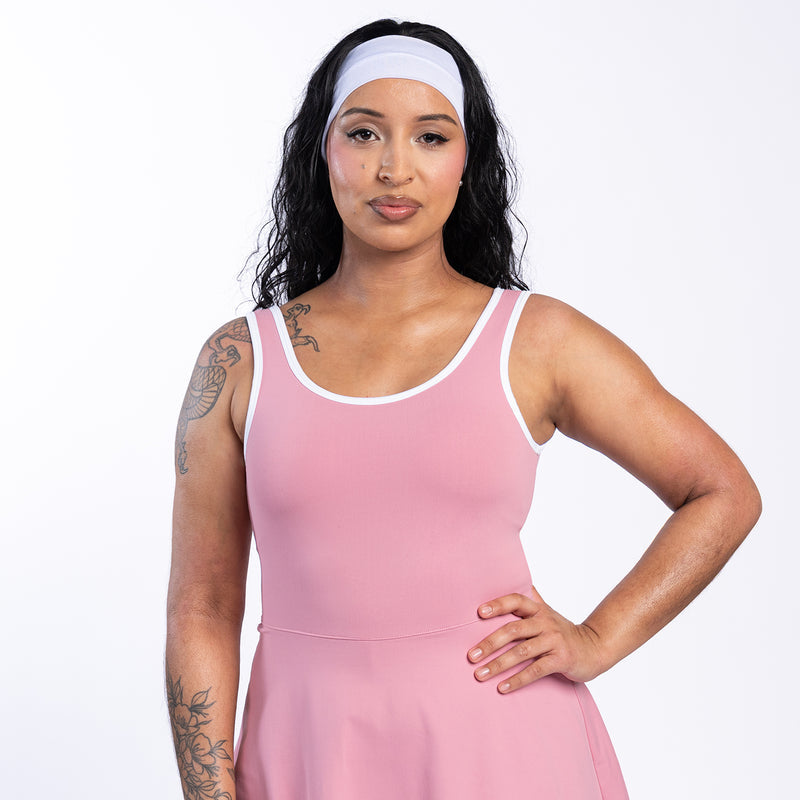 Rose pink sleeveless mini dress with white-trim round neckline, fitted bodice