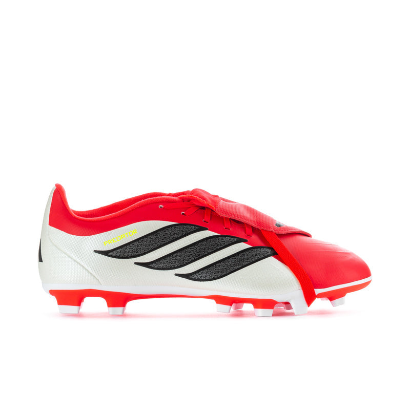 Men's soccer cleats in red, white, and black with molded studs and lace-up