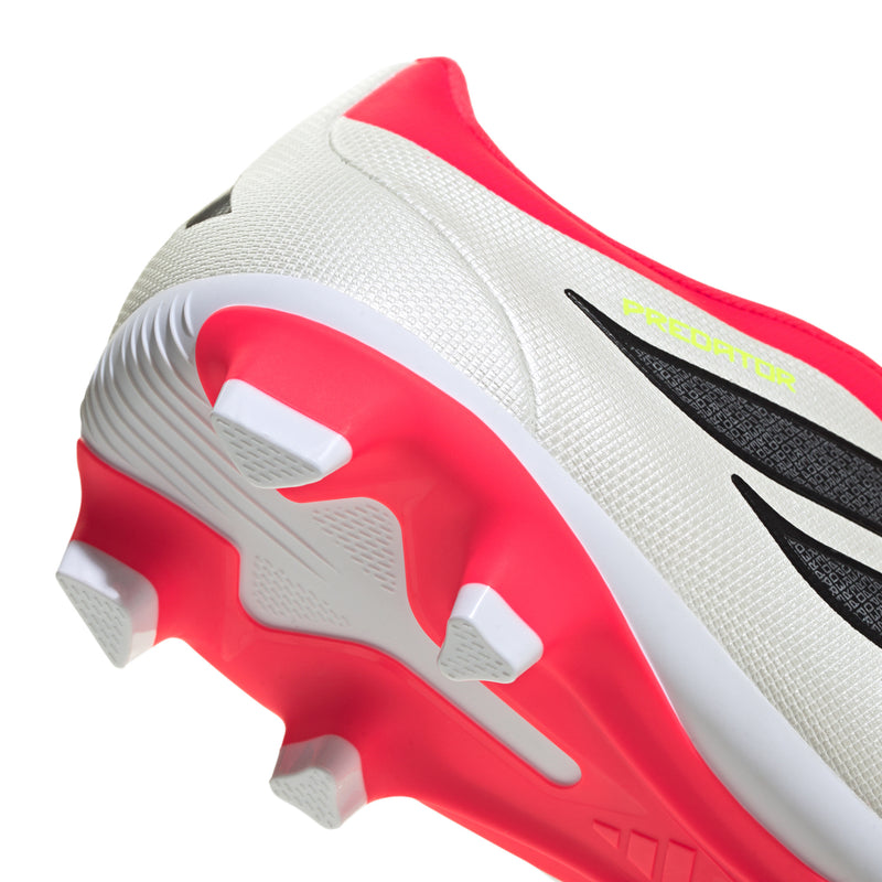 Men's soccer cleats side close-up: white upper with red sole and black branding