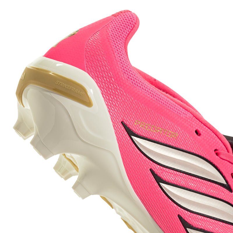 Close-up men's FG/MG cleat, pink upper with black swoosh and gold sole trim