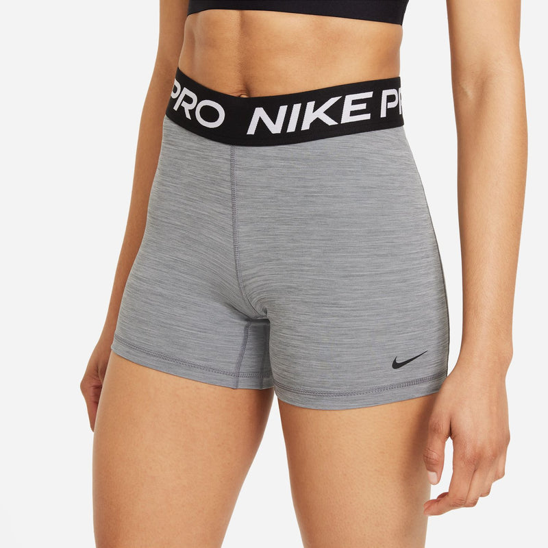 Smoke grey Nike Pro 5" bike shorts with black logo waistband and right-leg swoosh