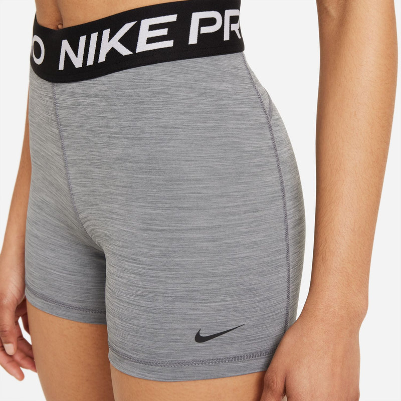 Smoke grey Nike Pro 5" bike shorts close-up with black waistband and side swoosh